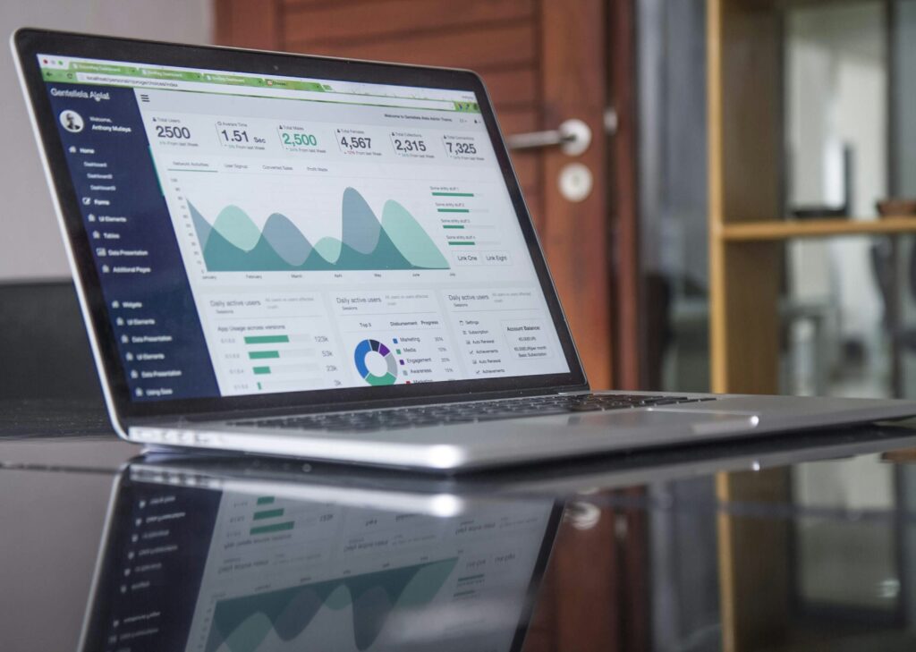 laptop on a glass table showing website speed